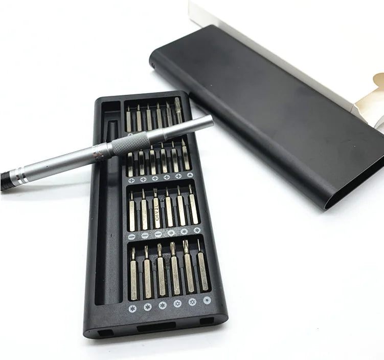 A hand holding a 25-in-1 Precision Screwdriver Set with various screwdrivers displayed in different sizes and shapes, predominantly black in color.