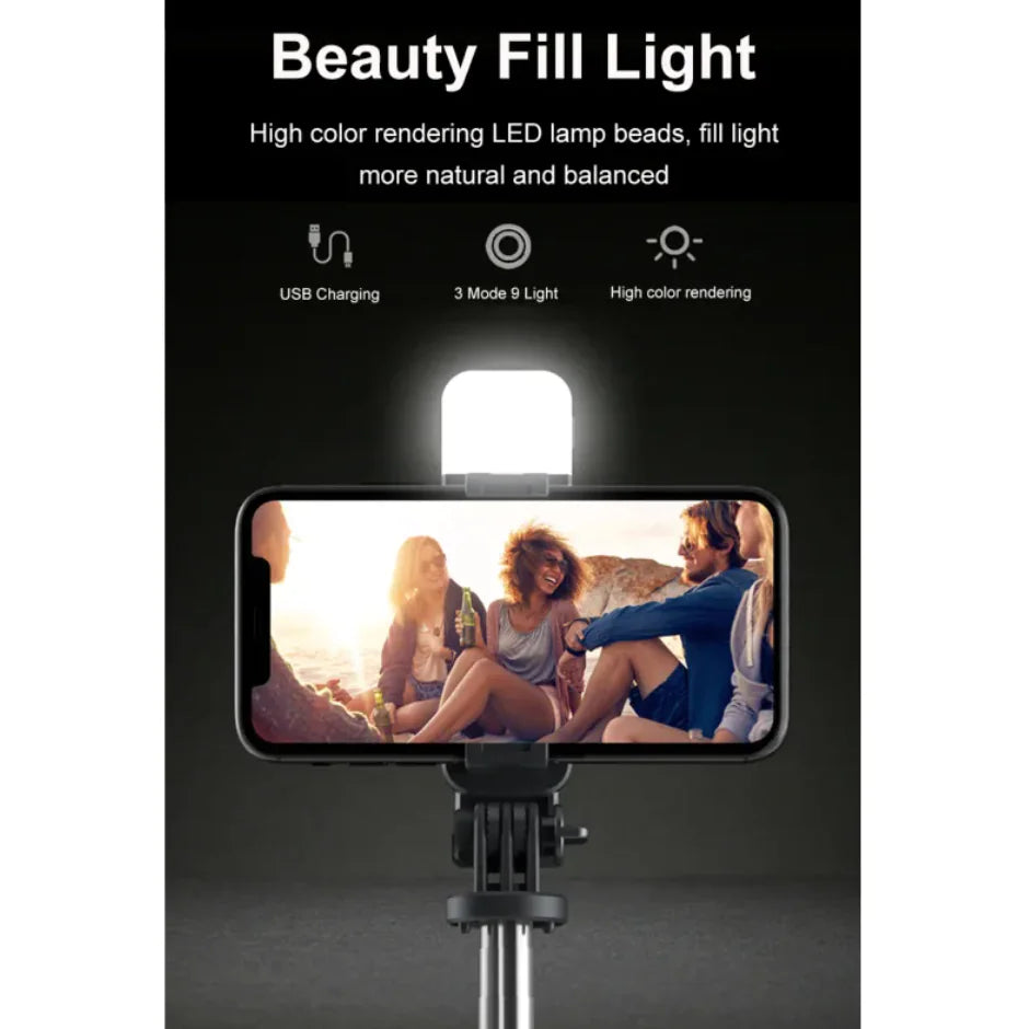A 3-in-1 Bluetooth wireless selfie stick and tripod, with the device mounted on the tripod, displaying an image of a group of people on the smartphone screen.