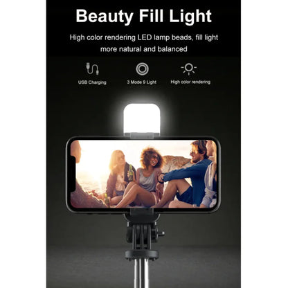 A 3-in-1 Bluetooth wireless selfie stick and tripod, with the device mounted on the tripod, displaying an image of a group of people on the smartphone screen.