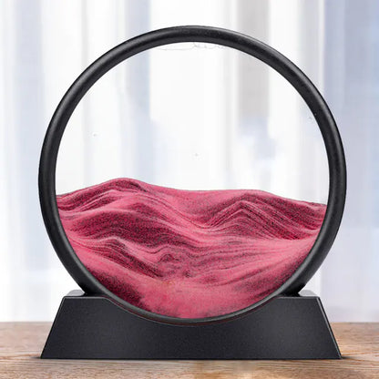 A round 3D hourglass lamp with red sand, set in a black frame on a white base, creating a visual effect of depth and time.