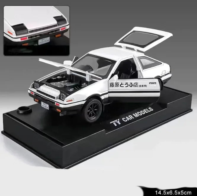 A white alloy car model displayed on a black stand, designed to resemble a real vehicle with detailed features.