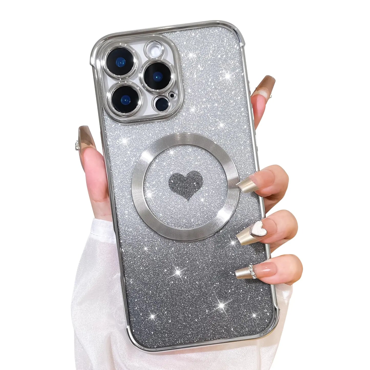 A hand holding a silver iPhone 16 Plus case with a glittery surface and a heart-shaped cutout for the camera.