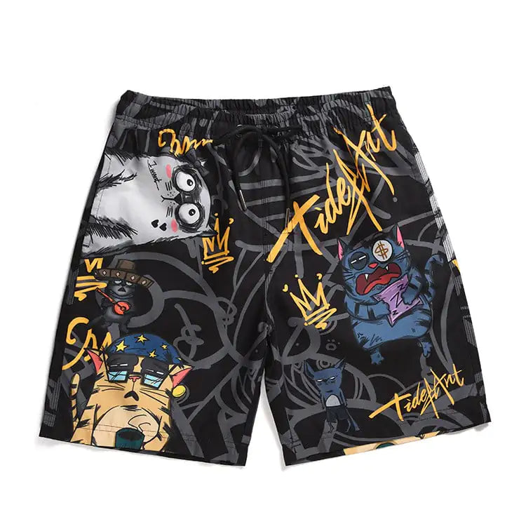 A pair of beach shorts with a camouflage and cat print pattern, featuring vibrant colors and text elements.