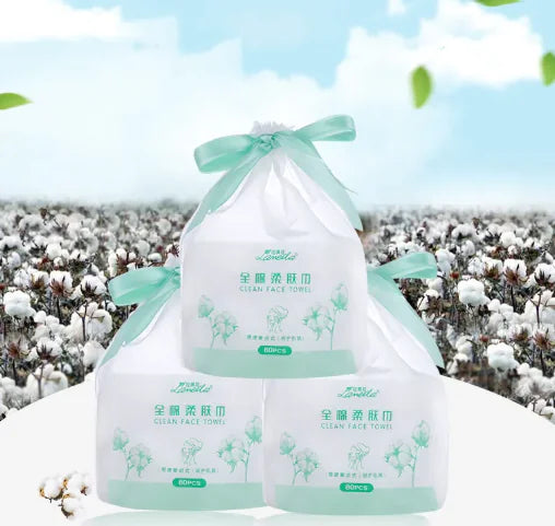 Pack of Clean Face Towels with a cotton field background, emphasizing the product's softness and purity.