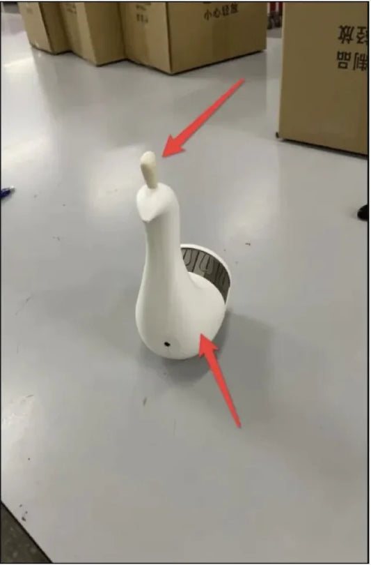 A white peacock-shaped 3D wall lamp with red arrows indicating the light source