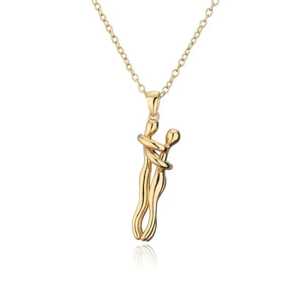 A pendant necklace with a stylized hug pendant symbolizing the connection between two loved ones.