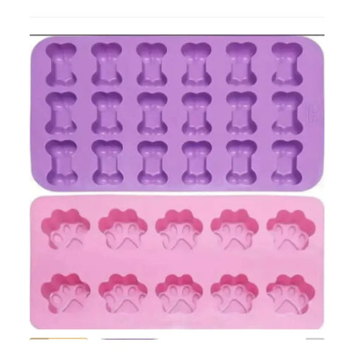 A silicone cake mold featuring shapes for dino bones, with two colors shown: purple and pink.