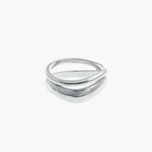 A double layered silver fashion ring with an irregular geometric design, displayed against a white background.