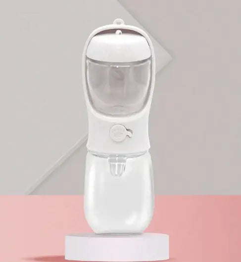 A portable dual-use dog drinking cup in pink color, with a water reservoir on top and a detachable compartment at the bottom for storing snacks.