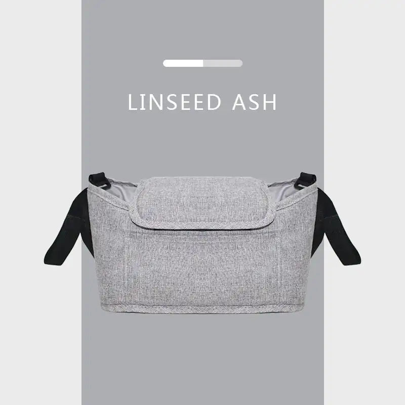Gray fabric bag with black straps on a gray background, labeled 'LINSEED ASH'.