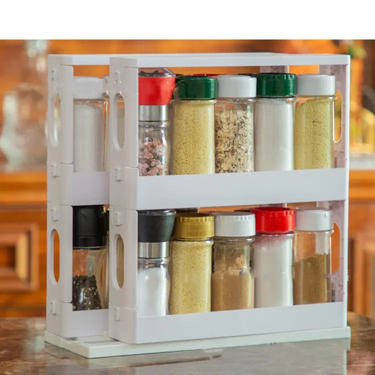 A black, European style rotating spice rack with a two-layer design