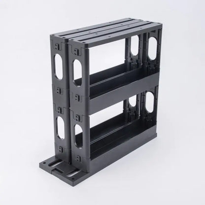 A black, European style rotating spice rack with a two-layer design