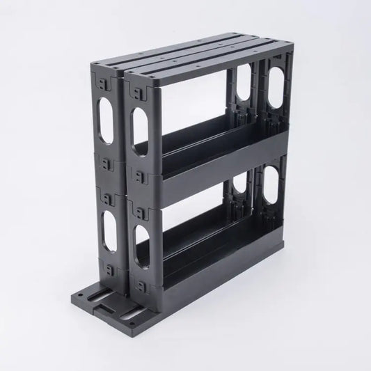 A black, European style rotating spice rack with a two-layer design