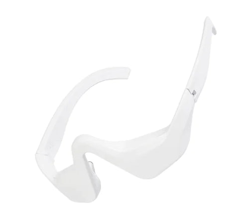 A white, sleek eye bag remover device with a curved design for the under-eye area.