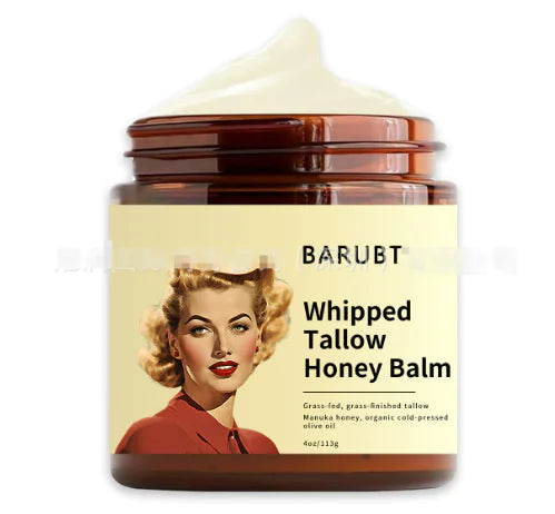 A jar of BARUBT Whipped Tallow Honey Balm with a vintage style label featuring a woman's portrait.