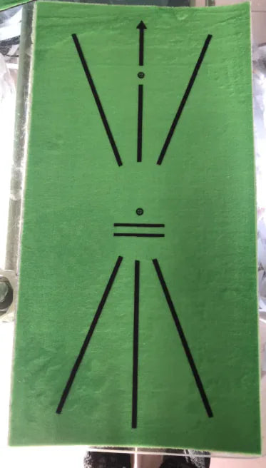 A green golf swing training pad with a black carrying bag and a chipping net, designed for golf enthusiasts to practice indoors or outdoors.