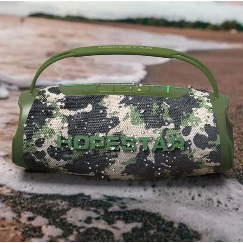 Red portable wireless Bluetooth speaker with a handle and multicolored LED light ring around the speaker grill.