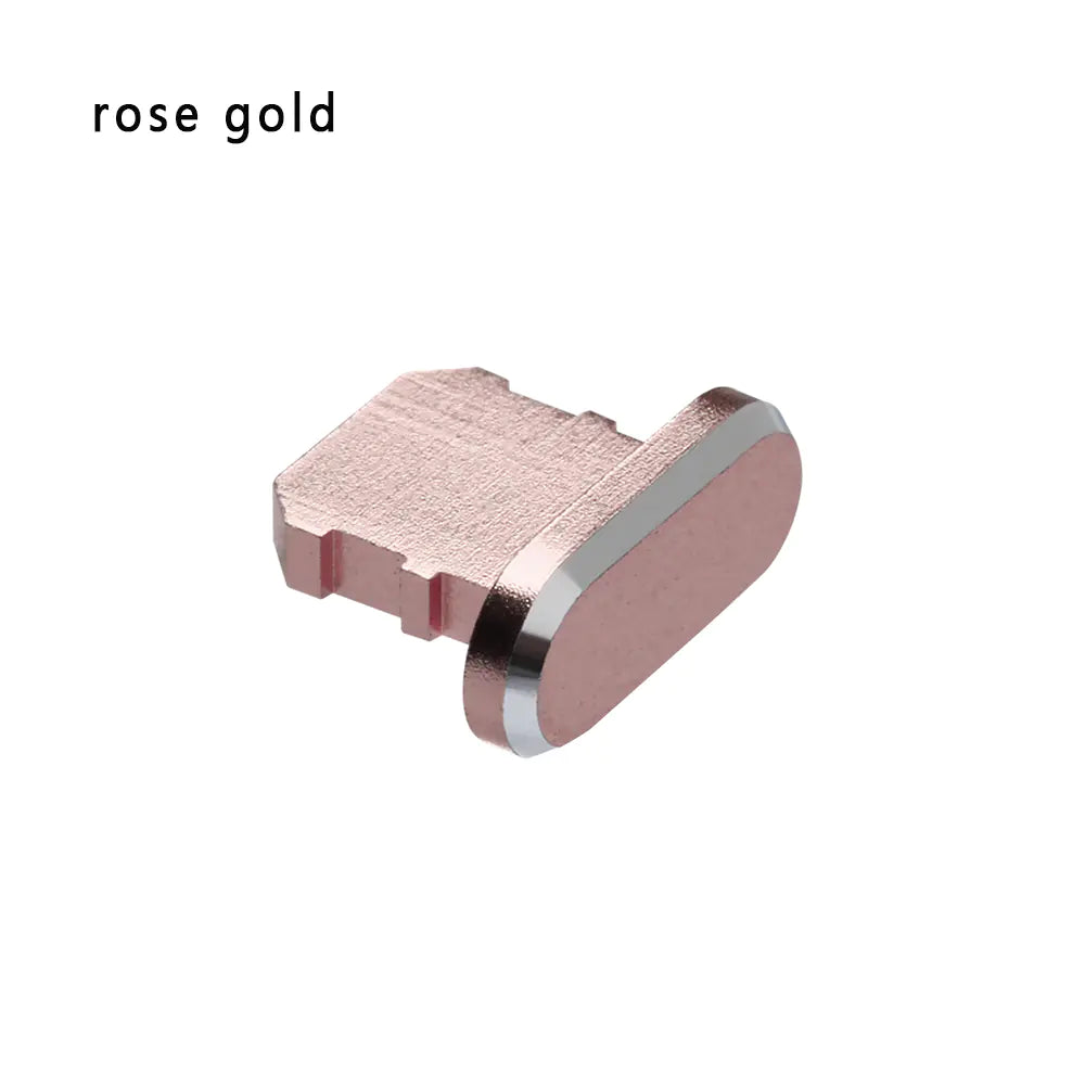 A rose gold dust plug for an iPhone's charging port made of aluminum alloy.
