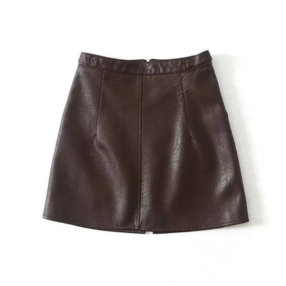 Two A-line PU leather mini skirts, one in black and one in wine red, with a high waist and zipper detailing.