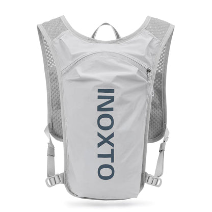 A black hydration backpack with blue text on the front, designed for running or outdoor activities.