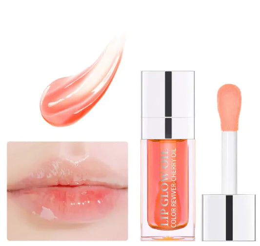 A moisturizing lip gloss product with a transparent formula, shown in a clear tube with a applicator wand, alongside a swatch of the gloss on a lip.