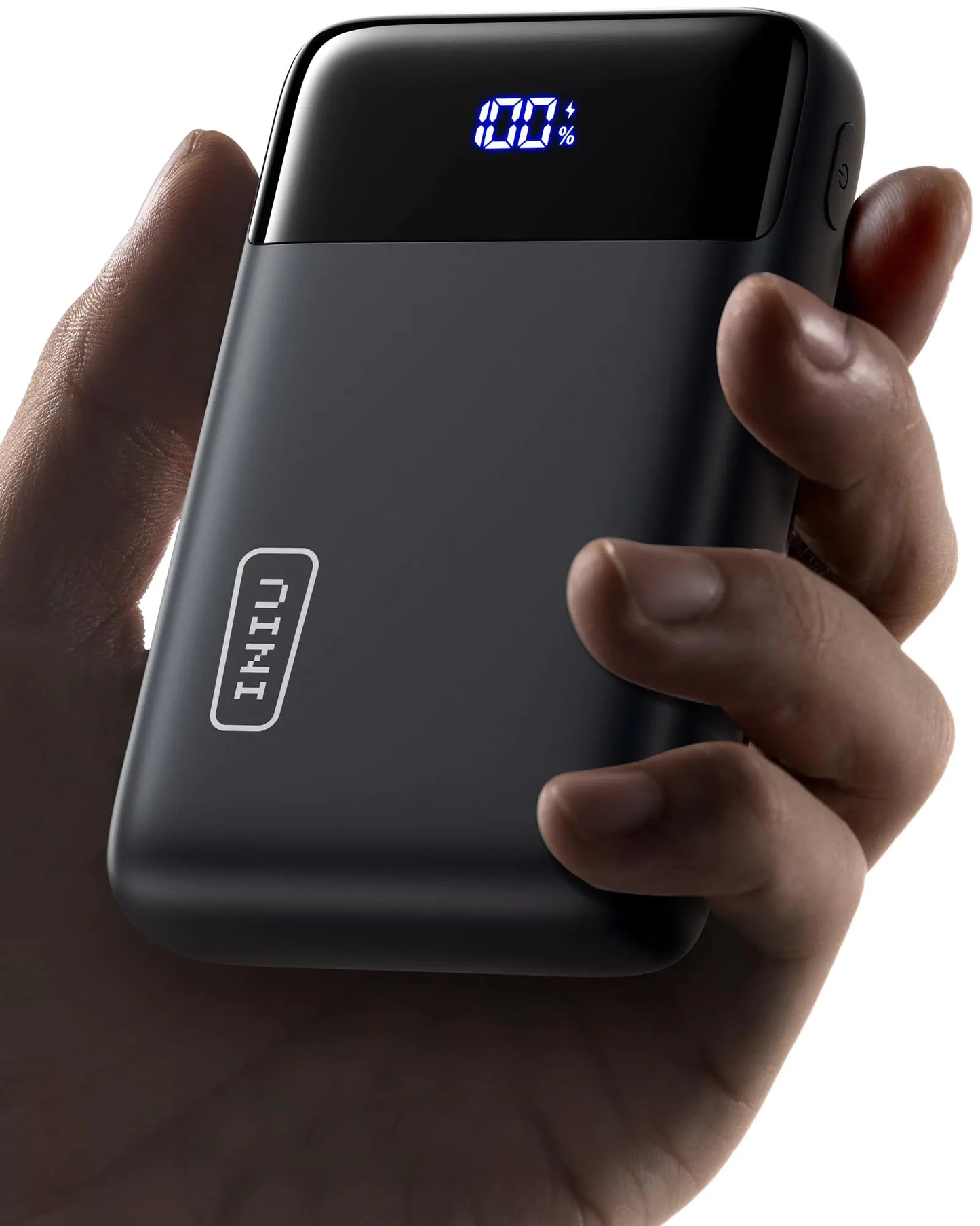 Black power bank with digital display held in a hand