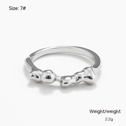 A silver-colored irregular metal ring with a geometric design, marked as size 7# and weighing 2.2 grams.