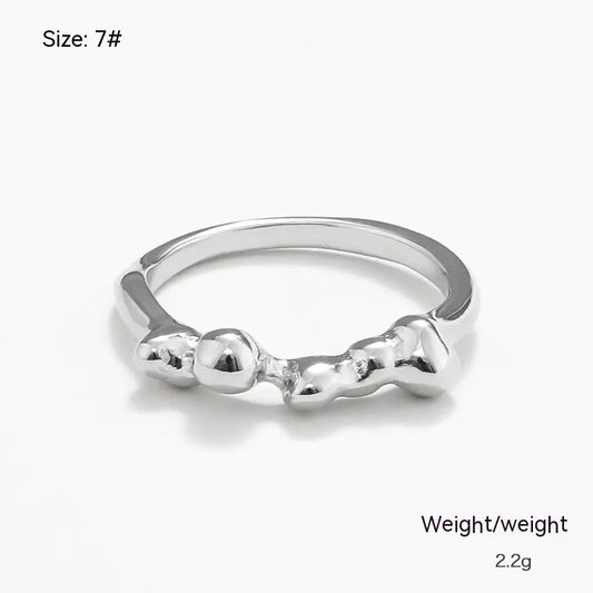 A silver-colored irregular metal ring with a geometric design, marked as size 7# and weighing 2.2 grams.