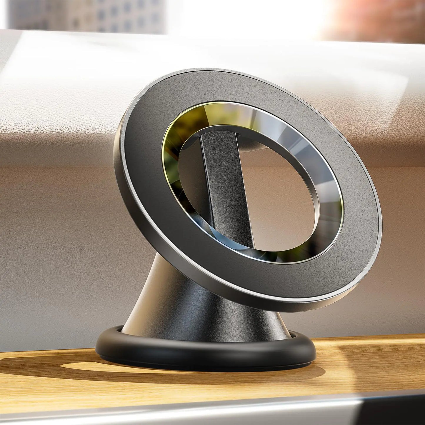 A black magnetic suction phone mount with a rotatable design, placed on a car dashboard.