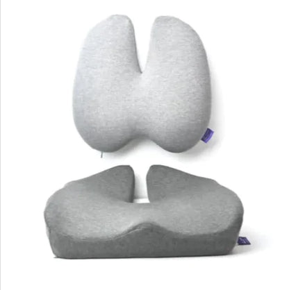 A pair of lumbar support cushions, one in a raised design and the other flat, both in gray color, displayed from different angles.