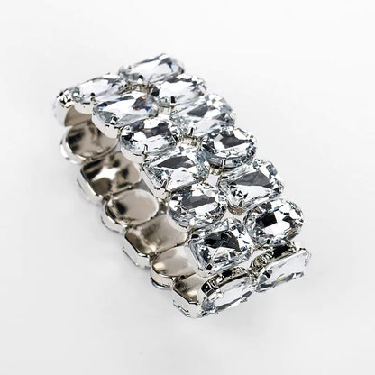 A silver fashion bracelet with a leaf shape and adorned with dazzling rhinestones.