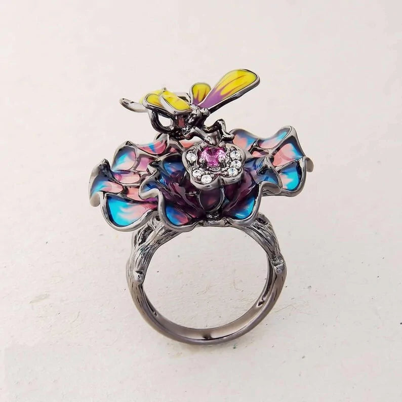 Bee Landing on Peacock Colored Flower WEM Support (www.WEM.support)