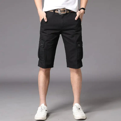 A pair of men's casual black shorts, showing a straight fit and mid-waist rise. The image depicts the shorts worn with a white t-shirt and white sneakers, highlighting the casual and outdoor-friendly style.