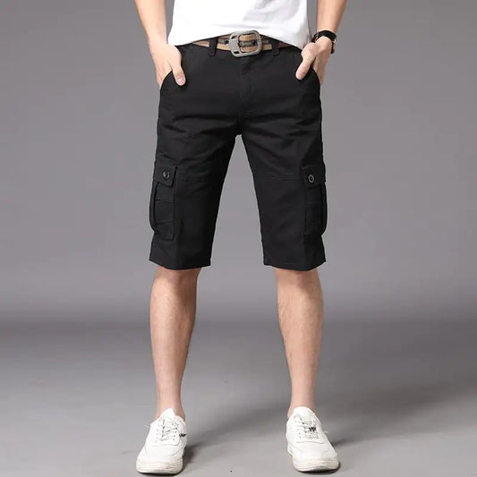 A pair of men's casual black shorts, showing a straight fit and mid-waist rise. The image depicts the shorts worn with a white t-shirt and white sneakers, highlighting the casual and outdoor-friendly style.
