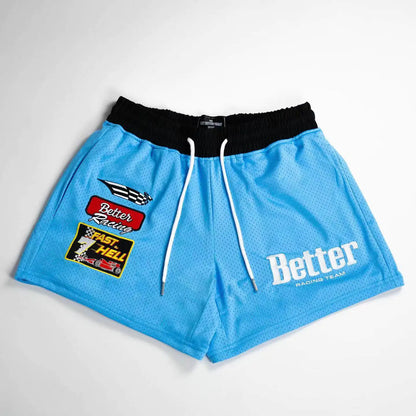 A pair of black men's basketball shorts with white drawstrings and white embroidery that reads 'Better' on the front, along with a small logo and text on the left leg.