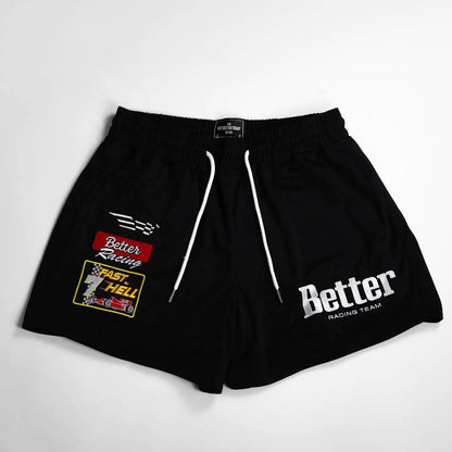 A pair of black men's basketball shorts with white drawstrings and white embroidery that reads 'Better' on the front, along with a small logo and text on the left leg.