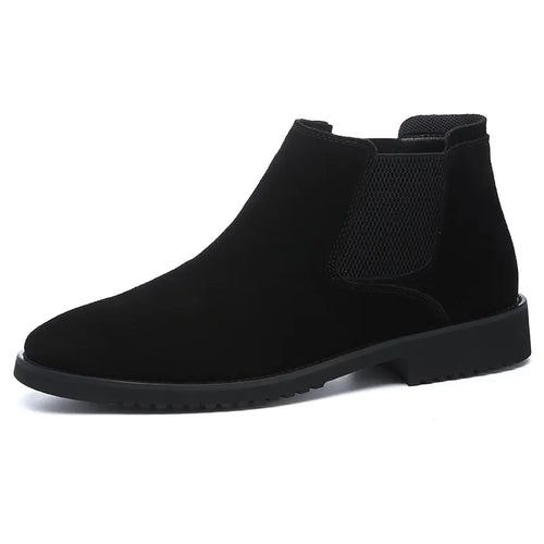 A pair of black high-top leather Chelsea ankle boots with a pointed toe and flat heel.