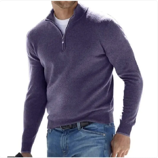 A man wearing a long-sleeve cashmere undershirt in purple with a collar, paired with blue jeans.