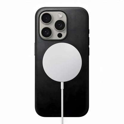 Black leather smartphone case with a circular cutout on the back for a magnetic charging accessory, compatible with iPhone 16 Pro.