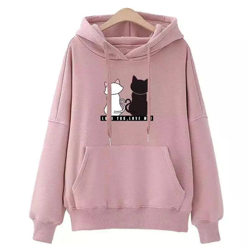 A pink hoodie with a graphic of a white cat and a black cat on the front, along with the text 'Korean style'.