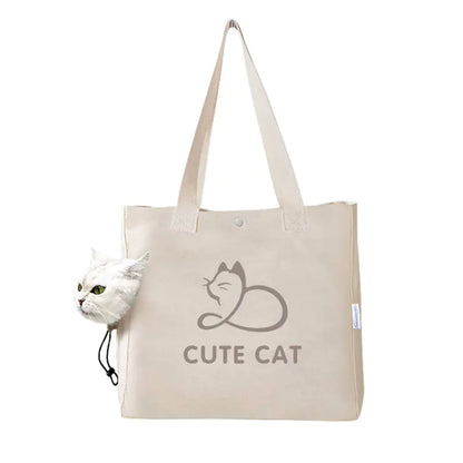 A white canvas handbag with a cute cat design and text 'CUTE CAT' is held by a person with a cat partially visible to the left of the frame.