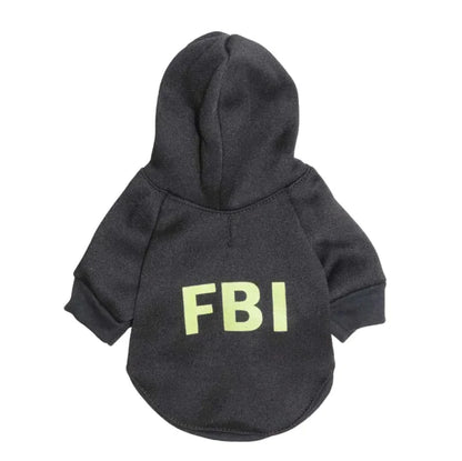 A dark-colored pet hoodie with 'FBI' printed in yellow letters on the back.