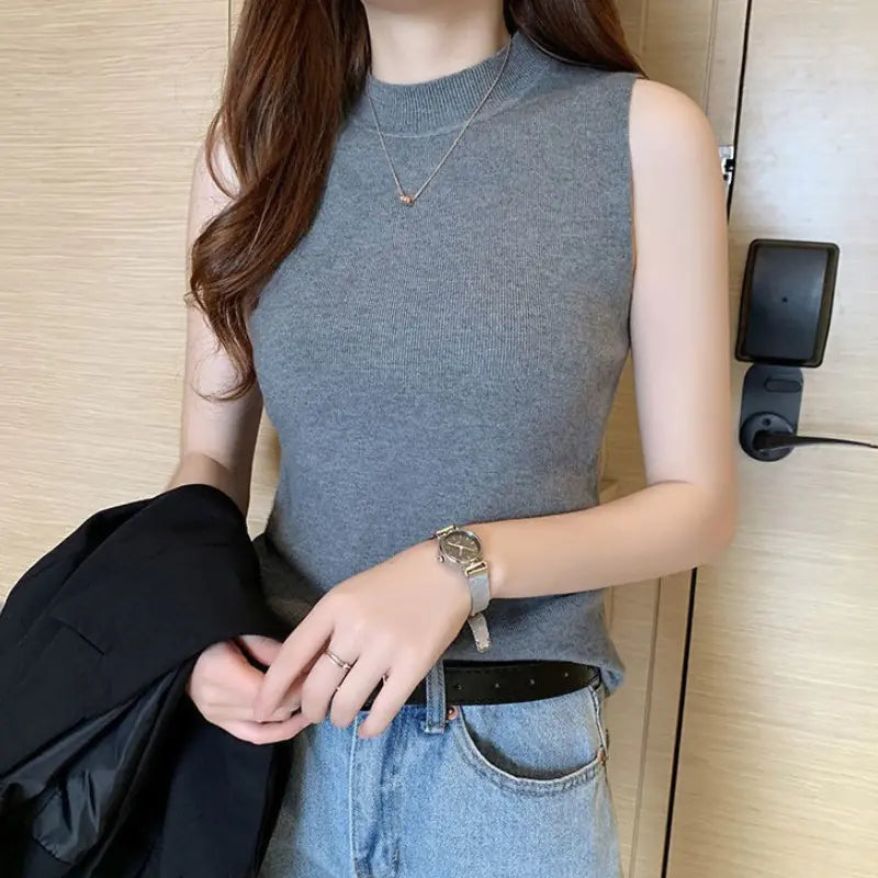 Women's small camisole vest with sweater underneath WEM Support (www.WEM.support)