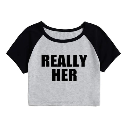 A gray and black cropped t-shirt with the text 'REALLY HER' printed in black on the front.