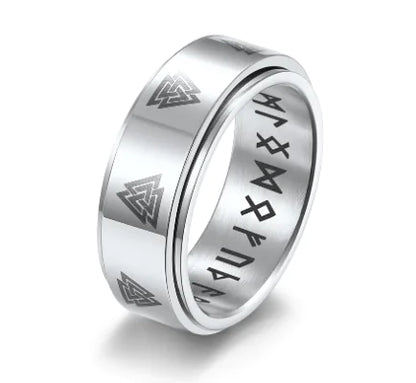 A stainless steel ring with a rotating triangle pattern design.