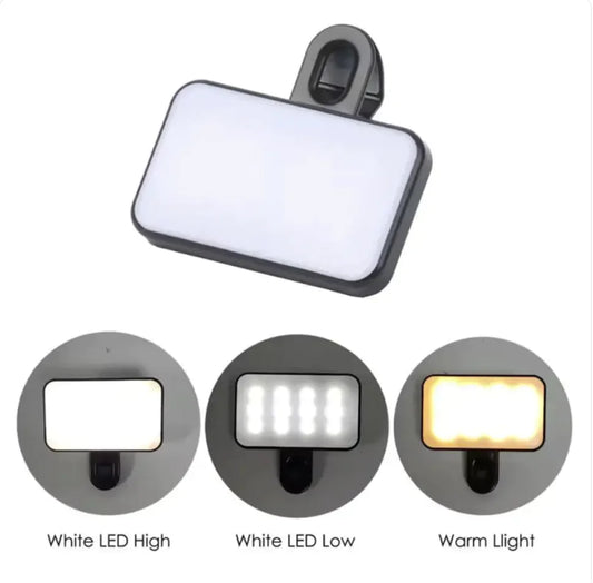 A black clip-on LED fill light for phones and computers with three lighting modes: White LED High, White LED Low, and Warm Light.