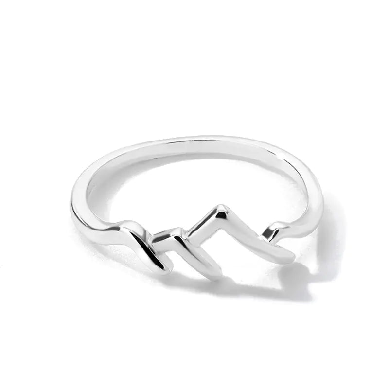 A gold-colored simple mountain peak creative ring on a white background.