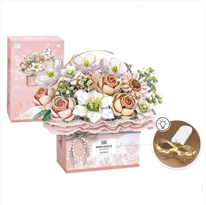 A Small Particle Building Blocks Set featuring a floral design with predominantly pink and white components, packaged in a box with a matching design.