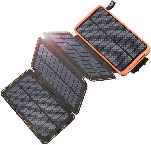 A portable solar charger with 4 foldable panels, predominantly black in color with orange edges.