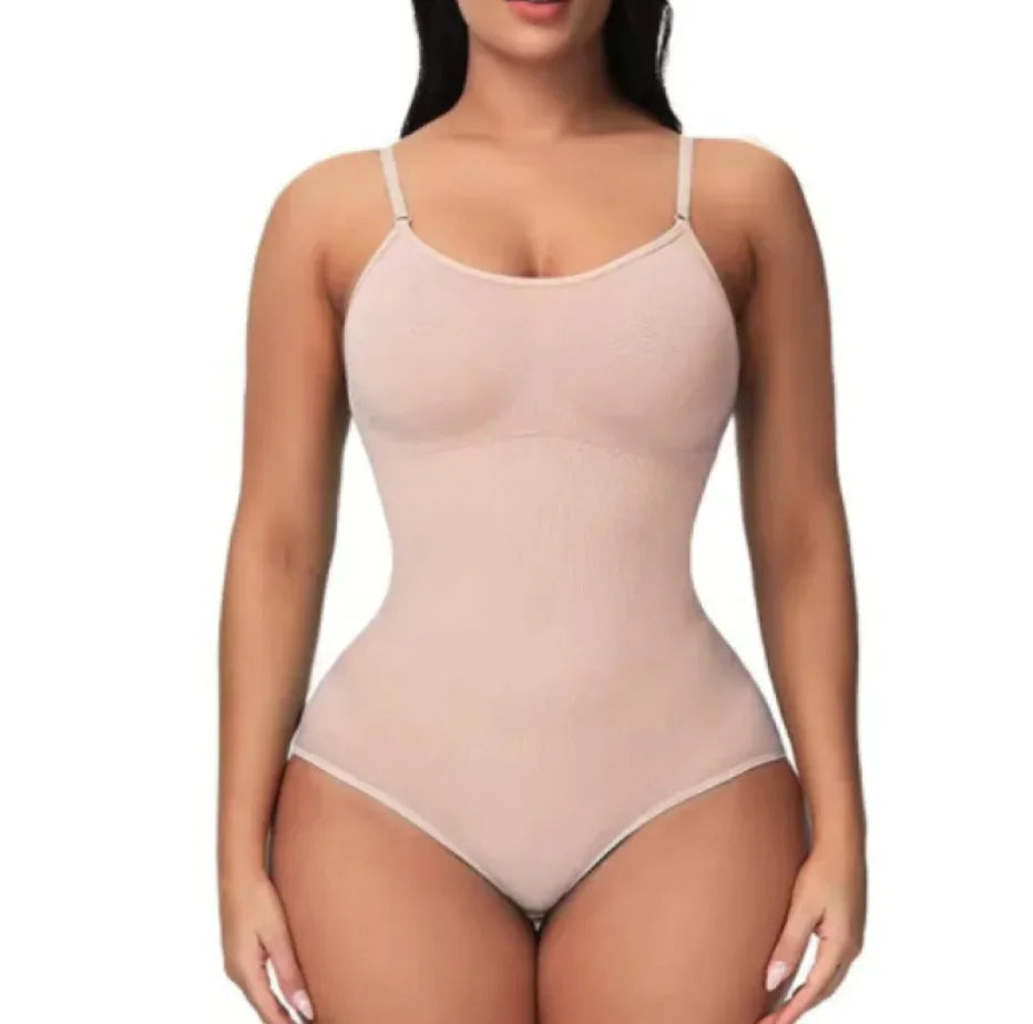 A woman wearing a black seamless corset with adjustable straps.